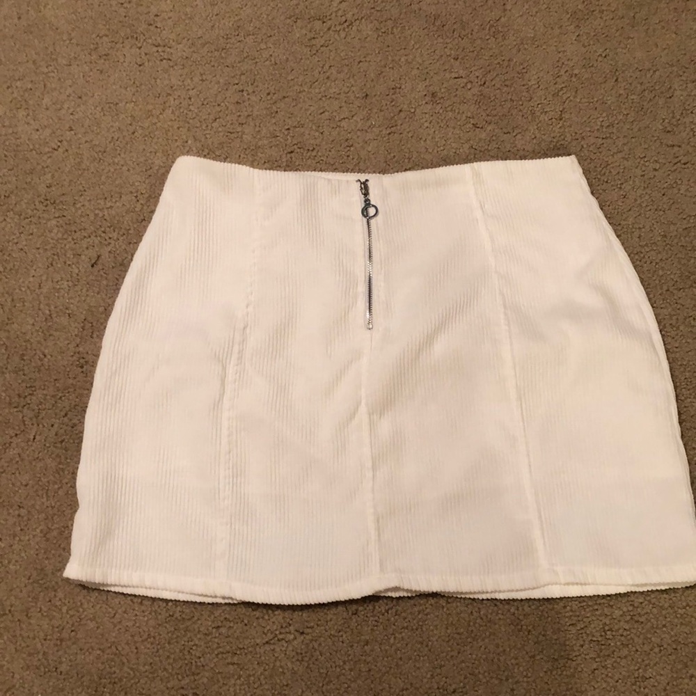 White skirt.